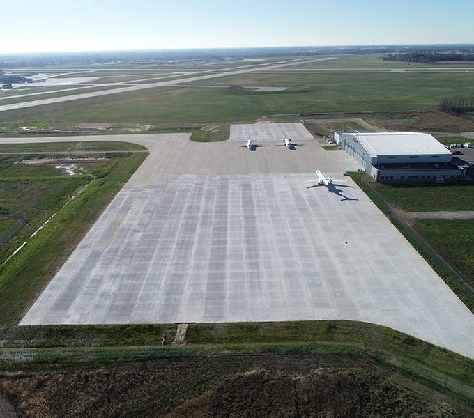 Aerial image of a large runway with airplanes on it.